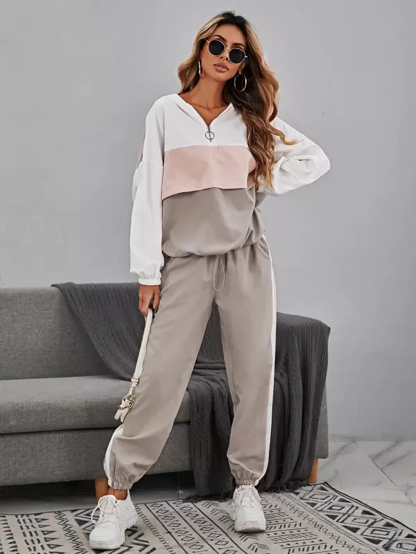 Full outfit from our women’s collection: neutral tracksuit and white sneakers